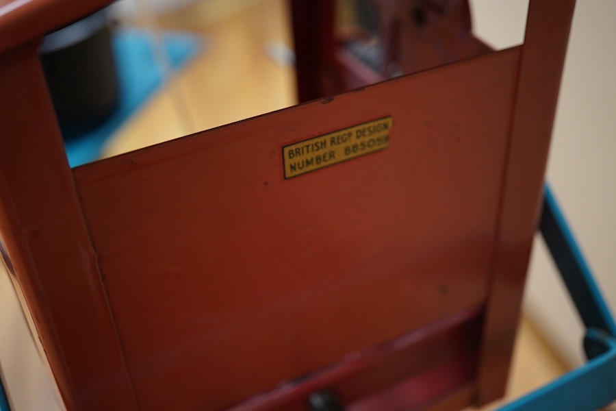 A 1950s Tri-ang large scale tinplate dockside crane with accessories including; a metal bucket, a plastic wrecking ball, etc. 88cm high to top of cab. Condition - fair to good, small patches of surface rust and some mino